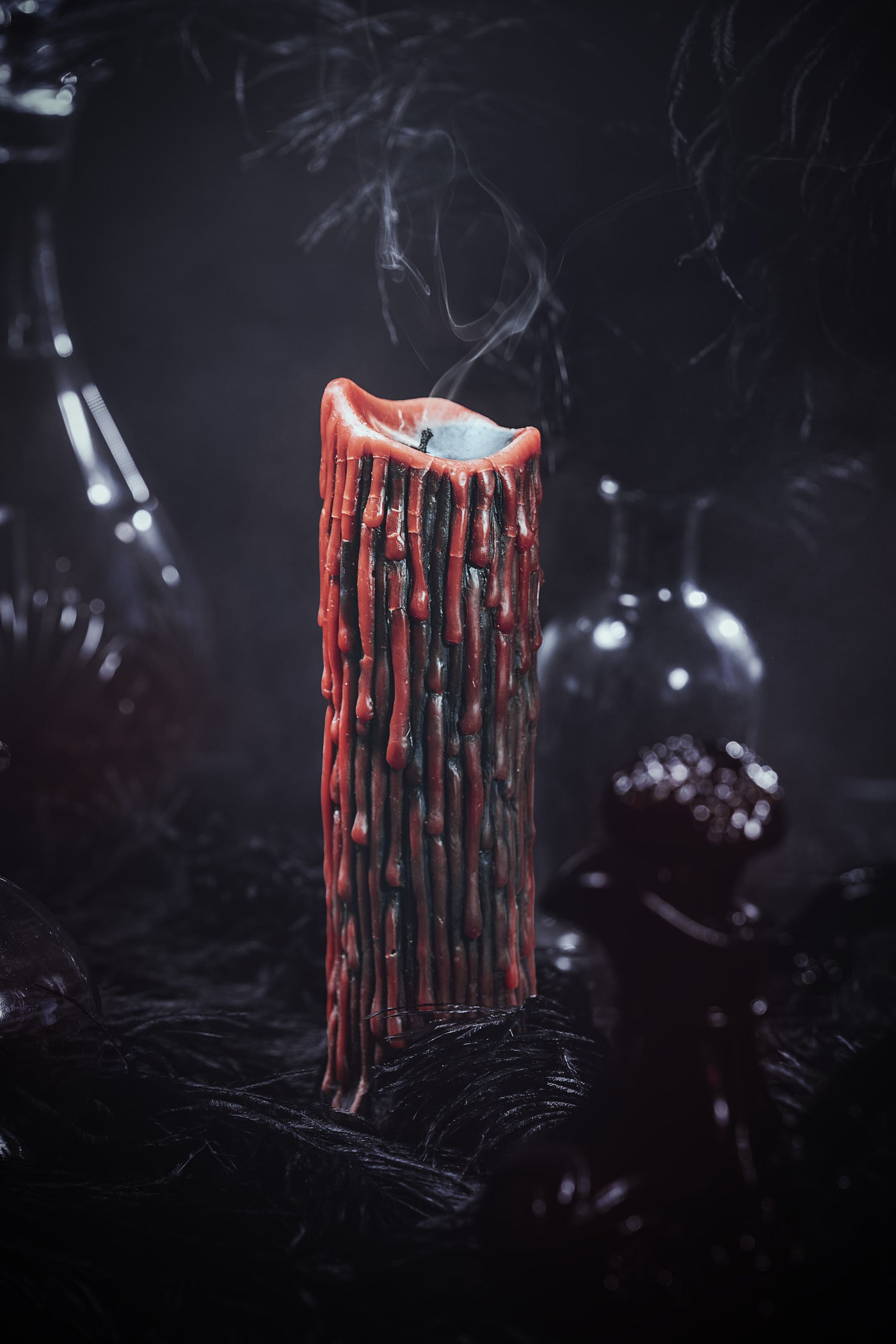red and black drippy candle